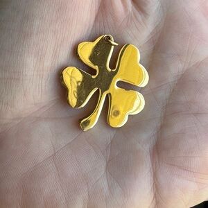 Gold Clover Pendant measures about 1 inch. Nice gold color no scratches.